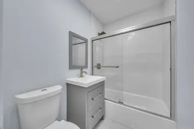 a bathroom with a shower and a toilet and a sink at 5 Bedroom Home Location & Charm in Miami