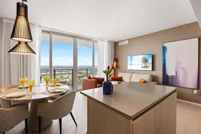 a kitchen and living room with a table and chairs at 42nd Floor Penthouse 3 BDR in Hyde Beach House in Hollywood