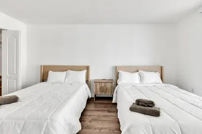 two beds sitting next to each other in a bedroom at Luxury Miami Brickell Stay-Bay View in Miami