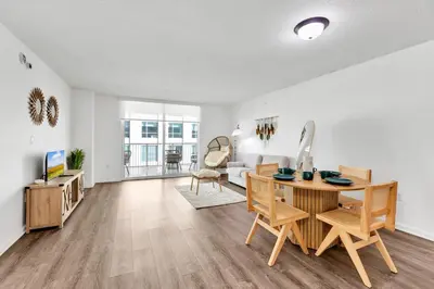 a living room with a table and chairs and a couch at Luxury Miami Brickell Stay-Bay View in Miami