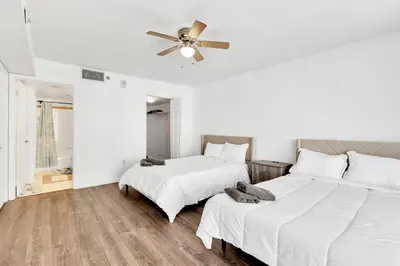 a bedroom with two beds and a ceiling fan at Luxury Miami Brickell Stay-Bay View in Miami