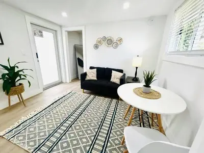 a living room with a couch and a table at Chic Comfortable Boutique Stay in Miami