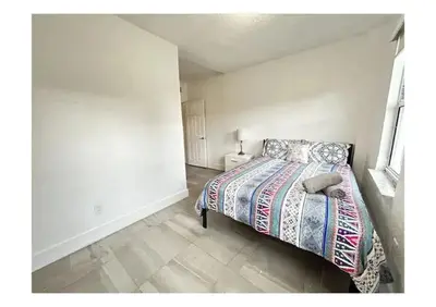 a bedroom with a bed in a white room at 2bed Stay in the Heart of Miami in Miami