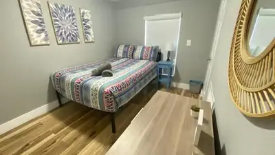a bedroom with a bed with a stuffed animal on it at 1Bed Abode Near Main Attractions in Miami