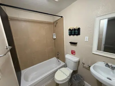 a bathroom with a toilet and a sink at 1Bed Abode Near Main Attractions in Miami