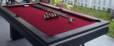 a red pool table with balls and cues on it at Luxury 3BR Duplex in Cutler Bay, Pool Table, BBQ, Terrace & Free Parking in Cutler Ridge
