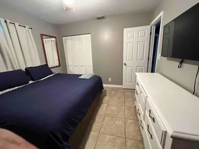 a bedroom with a bed and a flat screen tv at Known for its beaches & walk to downtown Hollywood Bliss 3 in Hollywood