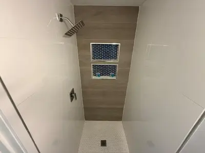 a bathroom with a shower with a window at Prime Location Near Wynwood in Miami