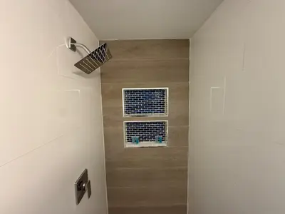 a bathroom with a shower with a window at Prime Location Near Wynwood in Miami