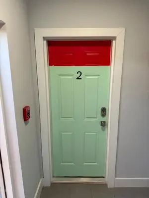 a green door with the number on it at Perfect Central Stay in Miami