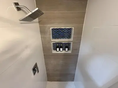 a bathroom with a shower and a window with shoes at Perfect Central Stay in Miami