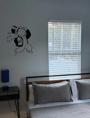 a bedroom with a cartoon character on the wall at Stay Near Wynwood in Miami