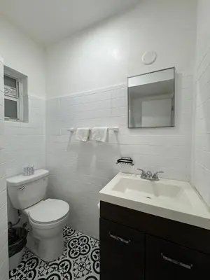 a white bathroom with a toilet and a sink at Hotel Rainbow - Miami - Little Havanna in Miami