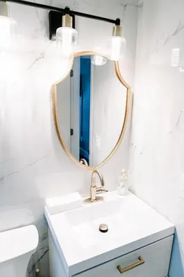 a bathroom with a sink and a mirror at Welcome to 305 Rentals in Miami Gardens