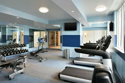 a gym with treadmills and cardio equipment in a room at Four Points by Sheraton Coral Gables in Miami