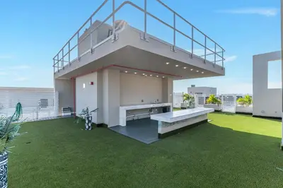 a house with a staircase on top of a lawn at Resort-Style 1 Bed Condo with Pool Parking Rooftop & Gym in Hollywood