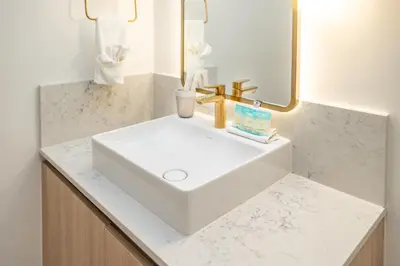 a bathroom with a white sink and a mirror at Phenomenal 1 Bed - Amazing views in Miami
