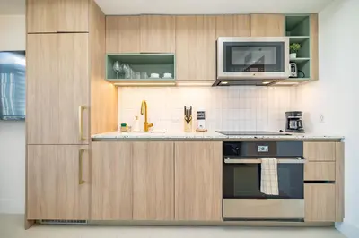 a kitchen with a microwave and a stove at Phenomenal 1 Bed - Amazing views in Miami