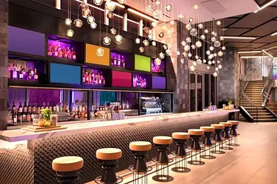 a bar in a restaurant with stools at Great Miami Stay Steps from Bayside & the Beach in Miami