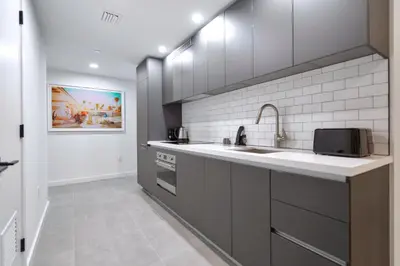 a kitchen with a sink and a microwave at Great Miami Stay Steps from Bayside & the Beach in Miami