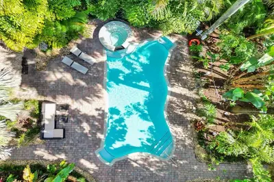 an overhead view of a large blue water slide at Tropical Oasis Studio w Pool in Fort Lauderdale