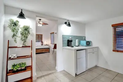a kitchen with white walls and a counter top at Tropical Oasis Studio w Pool in Fort Lauderdale