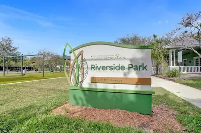 a sign for the riverside park in front of a house at Tropical Oasis Studio w Pool in Fort Lauderdale