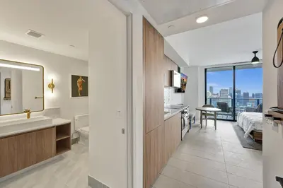 a bathroom with a sink and a mirror at On 47th Floor! Free Parking & Views From The Top in Miami