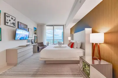 a hotel room with a bed and a television at Condo Closer The Sea and Beatiful Views in Hollywood