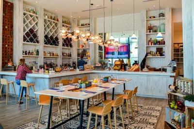 a restaurant with tables and chairs and a bar at Condo Closer The Sea and Beatiful Views in Hollywood