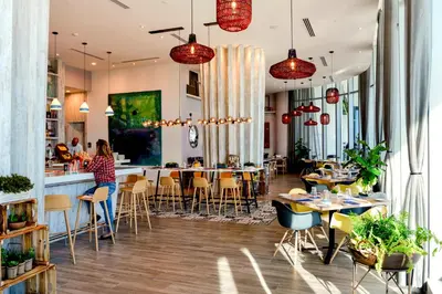 a restaurant with tables and chairs and a bar at Condo Closer The Sea and Beatiful Views in Hollywood