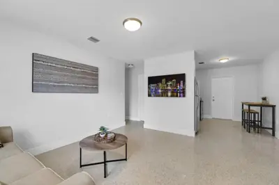 a living room with a couch and a table at Fab 4BR Twin Villas Near Design District and Wynwood in Miami