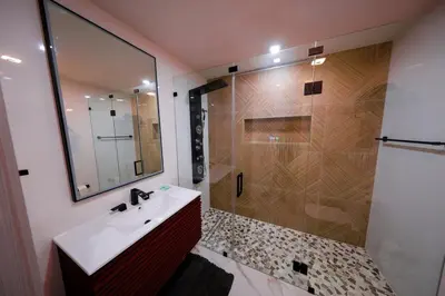 a bathroom with a shower and a sink and a mirror at New! Upscale Modern waterfront apartment 3BR 3BA in Miami