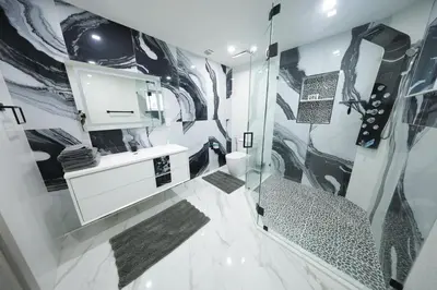 a bathroom with a shower and a sink at New! Upscale Modern waterfront apartment 3BR 3BA in Miami