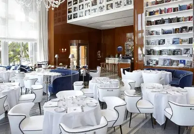 a dining room with white tables and white chairs at Magnificent Unit with Priceless Views W Icon in Miami