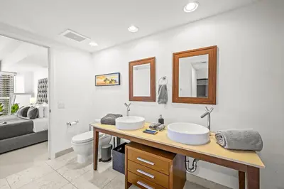 a bathroom with two sinks and a toilet at Magnificent Unit with Priceless Views W Icon in Miami