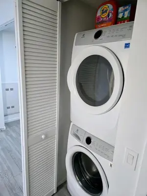 a white washer and dryer in a room at Miami Myami Miamí Studio Apartment with Balcony in Miami