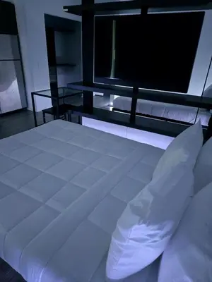 a bedroom with a white bed and a large window at Miami Myami Miamí Studio Apartment with Balcony in Miami
