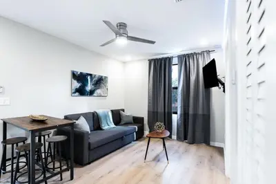 a living room with a couch and a table at Prestige Brickell Miami Suite in Miami