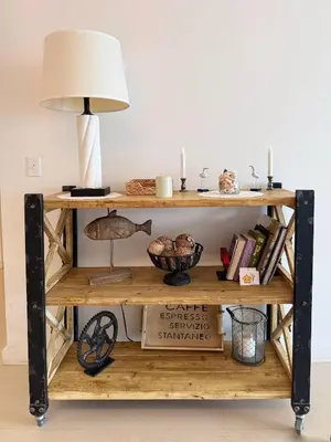 a wooden shelf with a lamp and books at 1 SPRING PROMO - Sunny Isles Seaview Condo, Walk to Beach, Amazing Amenities in Sunny Isles Beach
