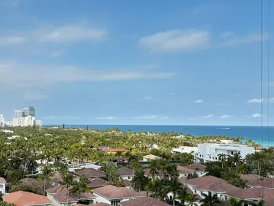 a view of the beach and buildings and the ocean at 1 SPRING PROMO - Sunny Isles Seaview Condo, Walk to Beach, Amazing Amenities in Sunny Isles Beach