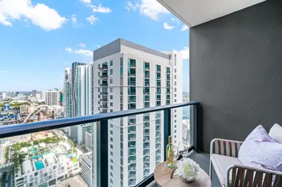 a balcony with a view of a tall building at 37th Floor - 1bdrm Unt amazing View at Downtown Miami in Miami