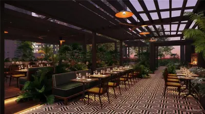 a restaurant with tables and chairs and plants at Oasis Studio with Gym & Pool in Miami