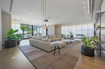 a living room with a couch and some plants at Stylish Studio -Amenities & Pool in Miami