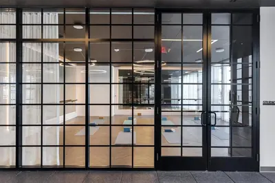 an open glass door of an office building at Stylish Studio -Amenities & Pool in Miami