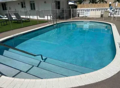 a large swimming pool with blue water at Modern in heart of Hollywood in Hollywood