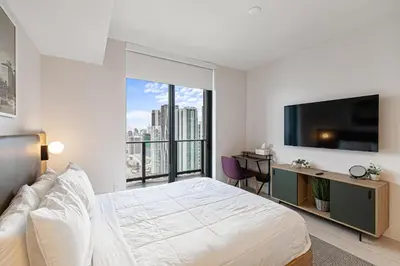 a bedroom with a bed and a large window at Grand Vista 4501 in Miami
