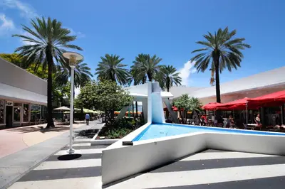 a resort with a swimming pool and palm trees at Grand Vista 4501 in Miami
