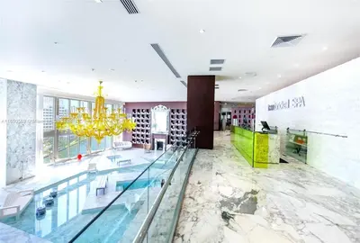 a lobby with a pool and a chandelier at Incredible Ocean View 1BR 1BA Icon Brickell in Miami