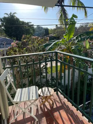 a balcony with a chair and a view at Beautiful suite in the best location in Miami! in Miami